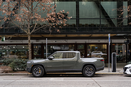 Seattle, USA – Jan 4th, 2023: An electric Rivian truck parked at the Amazon Spheres campus late in the day.