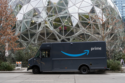 Seattle, USA – Jan 3rd, 2023: The 1st Amazon Go store with a Prime delivery van at the Spheres campus late in the day.