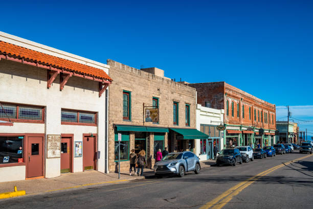 People walk on Main Street in downtown Jerome Arizona USA on a sunny day.
