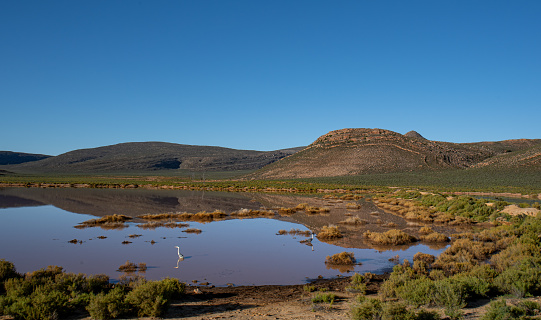 The beautiful rocky scenery reflecting in a lake east of Cape Town, South Africa.