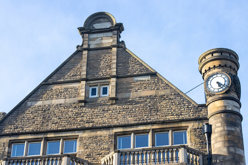 Clock tower above the cafe and bar of Bettys Café & Shop (founded 1919) on Parliament Street at Harrogate in North Yorkshire, England