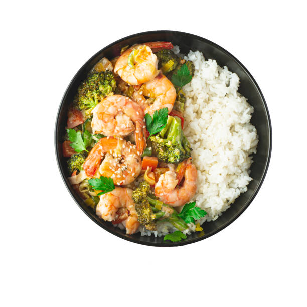 shrimps curry recipe,  shrimps  cooked in a rich savory curry sauce with vegetables.  economical and simple recipes with rice, indian, japanese and indonesian cuisine, isolated in white - healthy eating food rice high angle view imagens e fotografias de stock