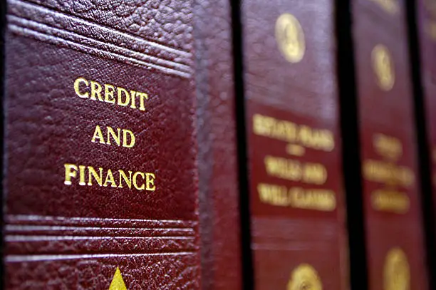 Close up of several volumes of law books of credit and finance