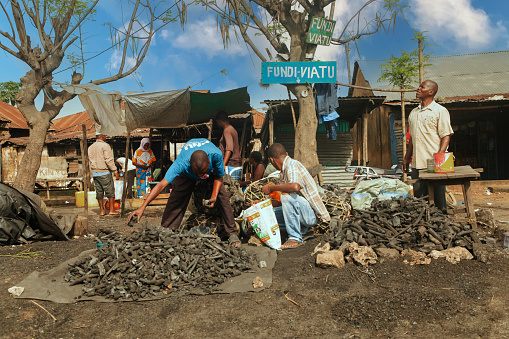 Mombasa,Kenya Africa. 19.10.2019 Street trading in Africa. Kenya. men sell coal at a spontaneous market along the road
