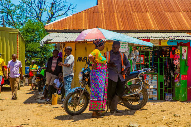DIani Mombasa Kenya 18 oktober 2019 .African woman and man talking while standing on the street near the road in the market  life in Kenya