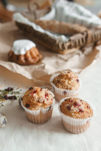 istock Easter cupcakes with raisins and quail eggs on a white table close-up. The concept of celebrating Happy Easter. 1459155824