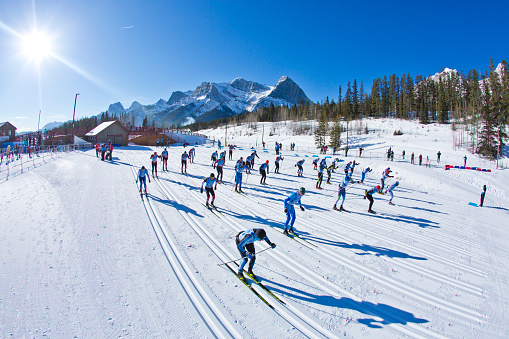 A group of men do a mass start at a cross-country ski race at the Canmore Nordic Centre Provincial Park in Alberta Canada. (John Gibson Photo / Gibson Pictures)