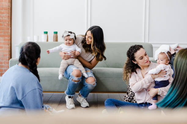 istock Young moms and their babies in playgroup 1459157288