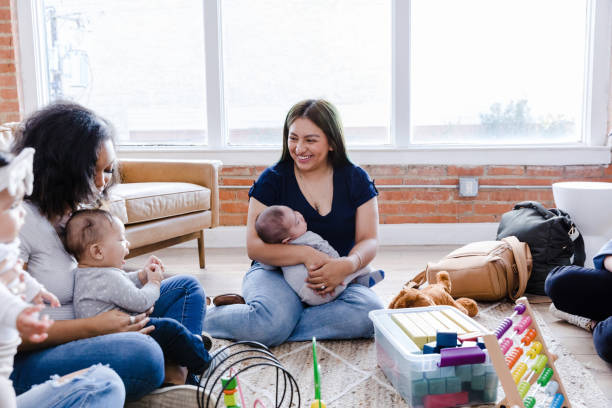 istock Diverse women sit on floor for young mom support group 1459157337