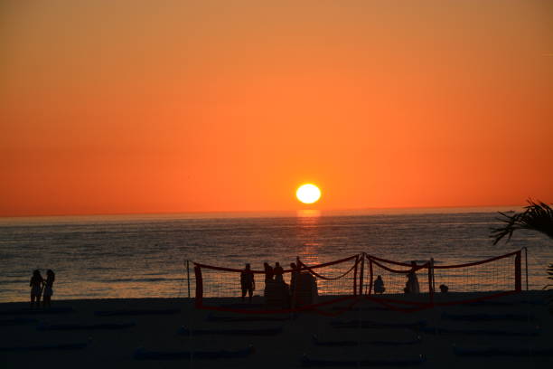 sun going down over the gulf in Florida stock photo