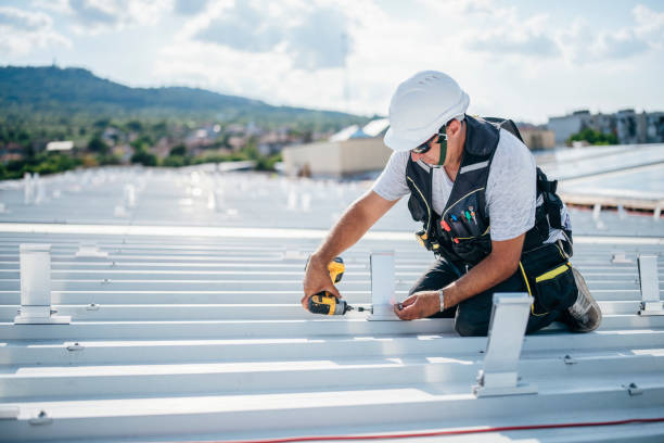 istock Male technician installing photovoltaic solar modules with screw. 1459157557