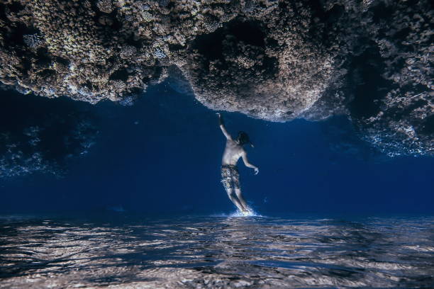 istock A man touches the sky - underwater abstract photography upside down (camera noises) 1459158244