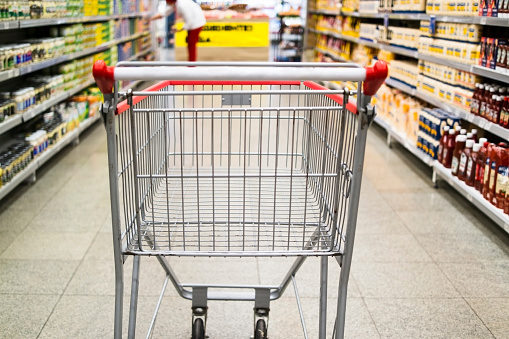 Photo of a shopping cart in a supermarket.