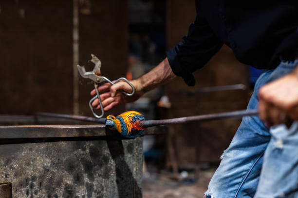 istock Glass blower at work in workshop in Murano, Italy 1459162644