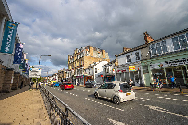 King's Road at Harrogate in North Yorkshire, England, with people, stores and cars visible.