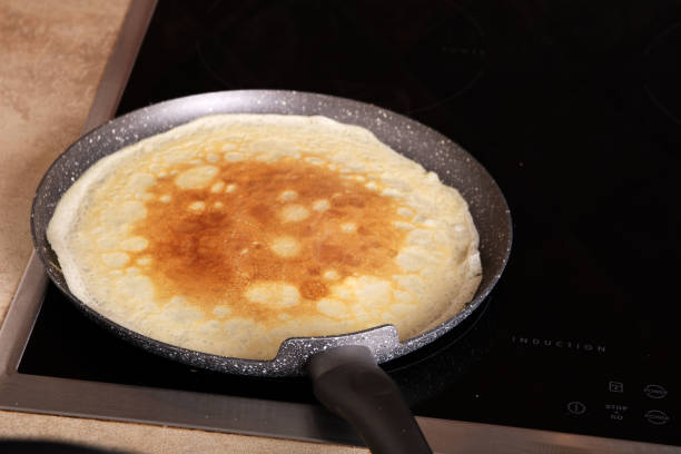 istock photo of a thin pancake cooked in a pan 1459167138