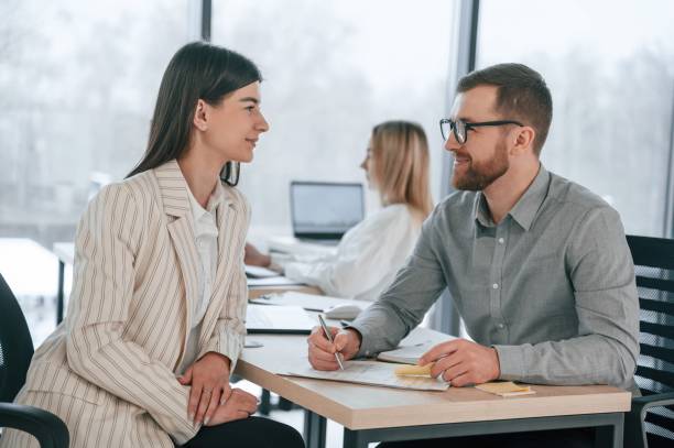 istock Discussing the project ideas. Successful team are working together in the office. Conception of business 1459168025