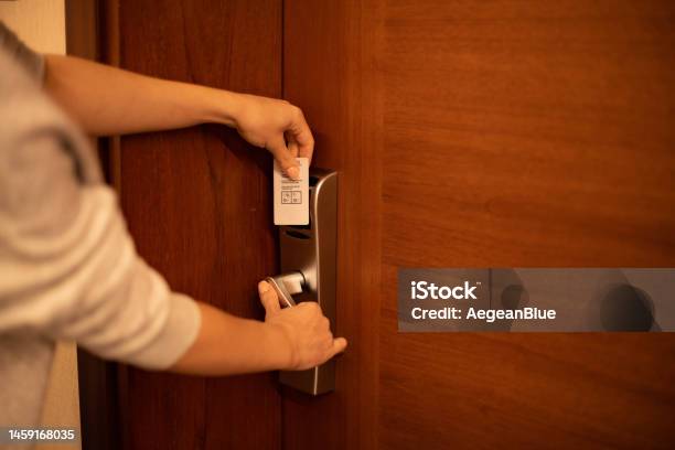 Woman Opening A Hotel Room Door With A Key Card Stock Photo - Download Image Now - Hotel, Unlocking, Door