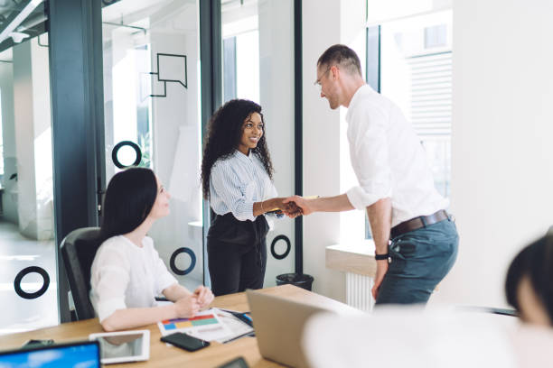 istock Business partners shaking hands at meeting 1459168166