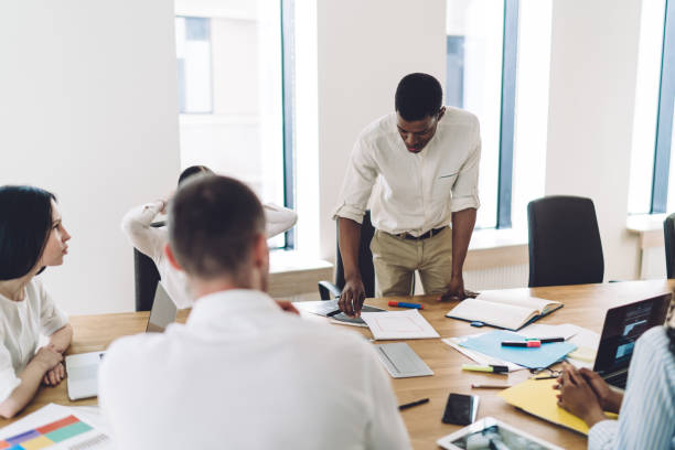 istock Office workers brainstorming in conference room 1459168206