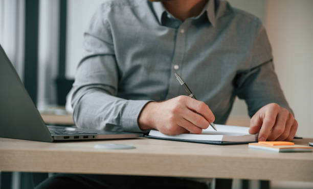 istock Businessman in formal clothes is working in the office 1459169272