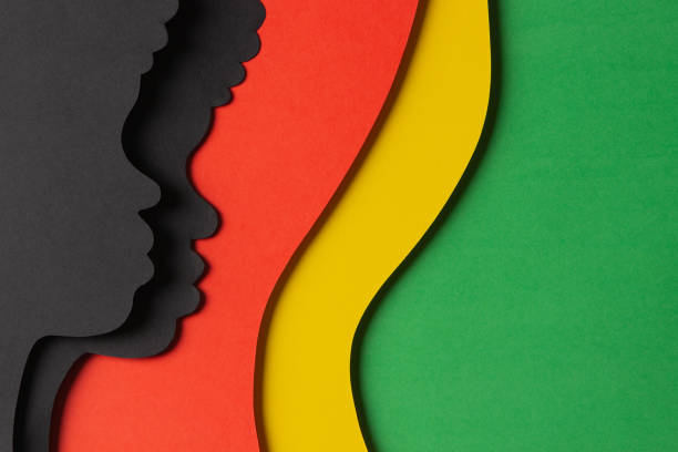 Black History Month color background. African Americans history celebration. Abstract geometric red, yellow, green color background with black paper cut people silhouette. Top view Black History Month color background. African Americans history celebration. Abstract geometric red, yellow, green color background with black paper cut people silhouette. Top view. black-history-people stock pictures, royalty-free photos & images