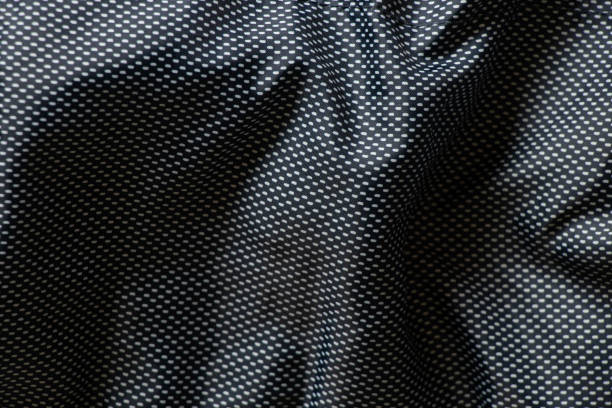 istock polyester blue fabric in small dot as background, blue wrinkled fabric for background, texture 1459171547