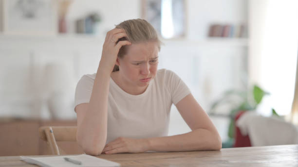 istock Upset Beautiful Young Woman Feeling Worried While Sitting in Office 1459172567