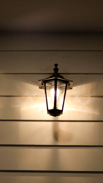 istock Classic wall electrical lamp decoration at night outside, bright and cozy. 1459174883