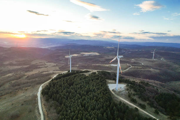 istock solar panels and wind turbines at sunset. renewable energy sources 1459175924