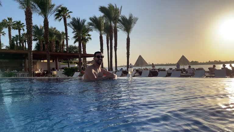 Mid adult man in a hotel pool