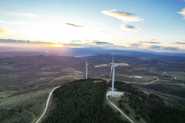 istock solar panels and wind turbines at sunset. renewable energy sources 1459176238