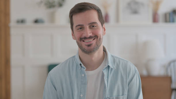 istock Portrait of Young Man Smiling at Camera 1459176408