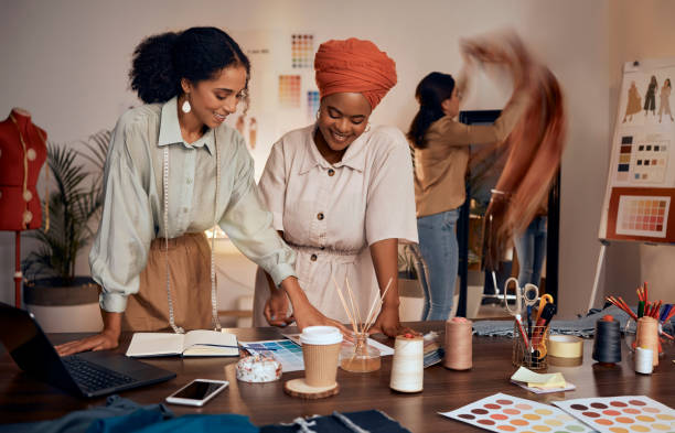 istock Designer, team creative collaboration and fashion designers working in studio for brainstorming, planning design and business people teamwork. Creativity, project plan or innovation in design agency 1459177960