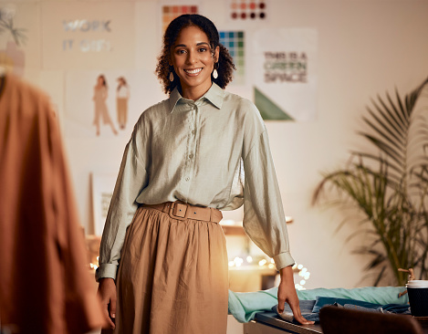 Fashion designer, black woman and portrait of a design workshop and creative studio worker. Smile, startup entrepreneur and retail store tailor feeling happy about small business and shopping vision