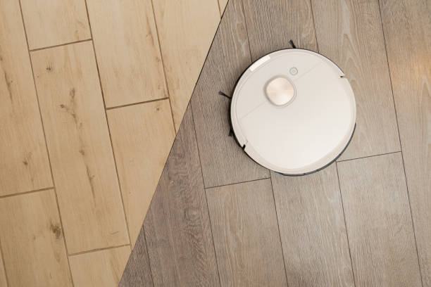 istock Autonomous robotic vacuum cleaner cleans floor in apartment 1459179724