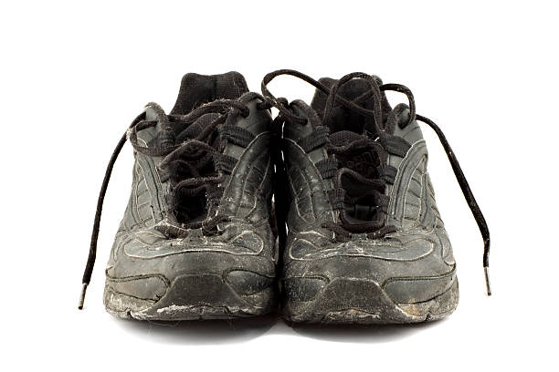 istock Old grungy Running Shoes isolated on white background 145918177