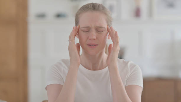 istock Distressed Beautiful Young Woman having Headache 1459184799