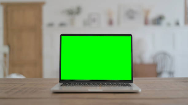 istock Open Laptop with Green Screen on Desk, Chroma Key 1459184977