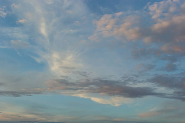 istock clouds in the sky illuminated by the sun summer evening. background 1459185265