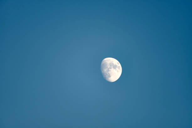istock An almost full moon on a blue background 1459186651