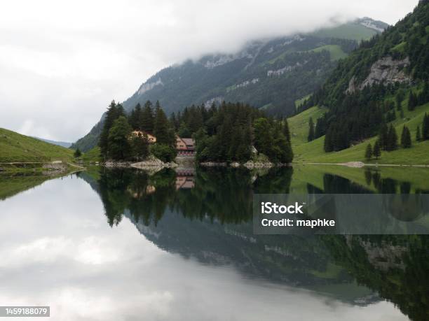 Reflection Of Berggasthaus Forelle In Alpine Lake Seealpsee In Alpstein Appenzell Alps Innerrhoden Switzerland Stock Photo - Download Image Now