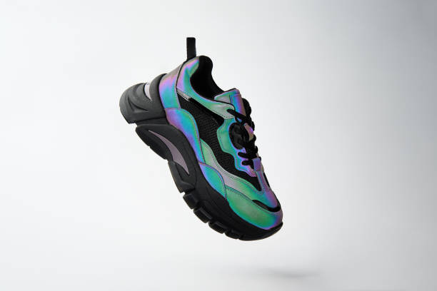 istock Fashion neon glowing sneaker on white background 1459188218