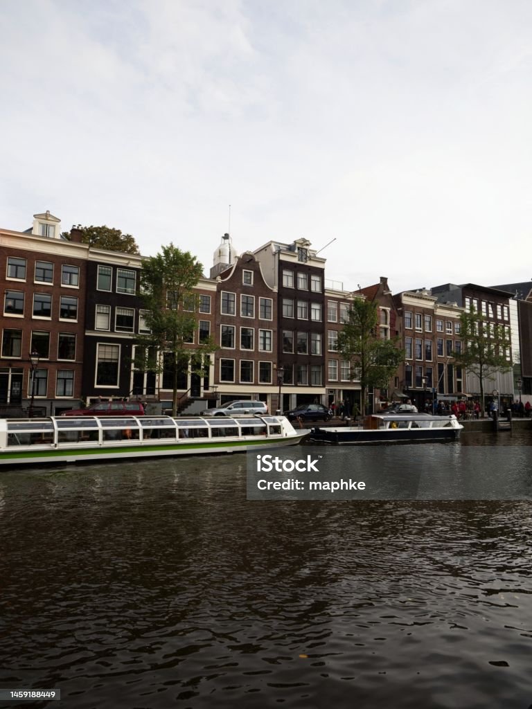 Typical Amsterdam buildings on Prinsengracht next to dutch Anne Frank House huis museum in Holland Netherlands Typical Amsterdam buildings on Prinsengracht next to dutch Anne Frank House huis museum Holland Netherlands Amsterdam Stock Photo