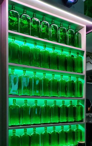 Array of Green bottles back lit with a green light
