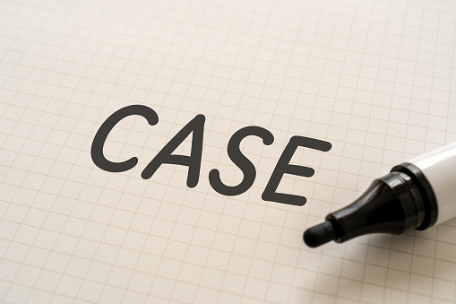White paper written “CASE” with a marker.