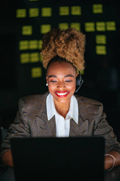 istock Happy Businesswoman Talking With Customer While Using A Laptop Computer In The Office 1459191083