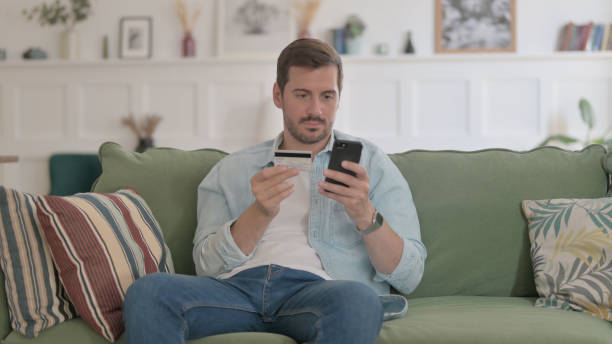 istock Young Man making Online Payment on Smartphone 1459191799