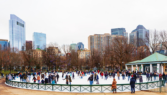 Boston, Massachusetts, USA - January 21, 2023: The Boston Common Frog Pond sits at the heart of Boston Common. Managed by The Skating Club of Boston in partnership with the City of Boston, Frog Pond is home to a winter ice skating rink and learn-to-skate school.