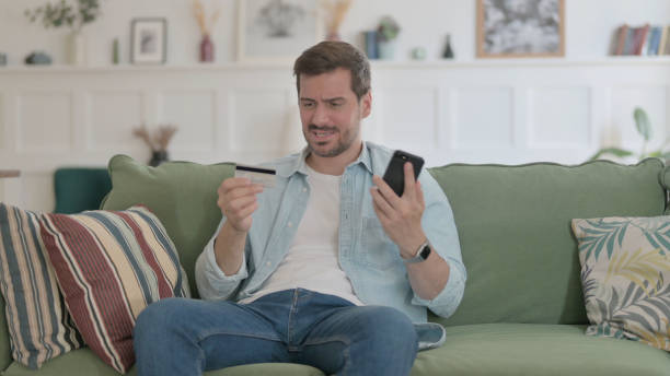 istock Young Man Unsuccessful Online Payment on Smartphone 1459191823